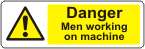 Danger Men working on machine